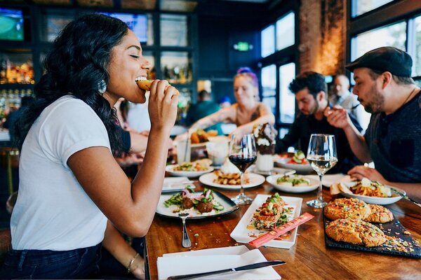 Woman enjoying herself by eating at a special event