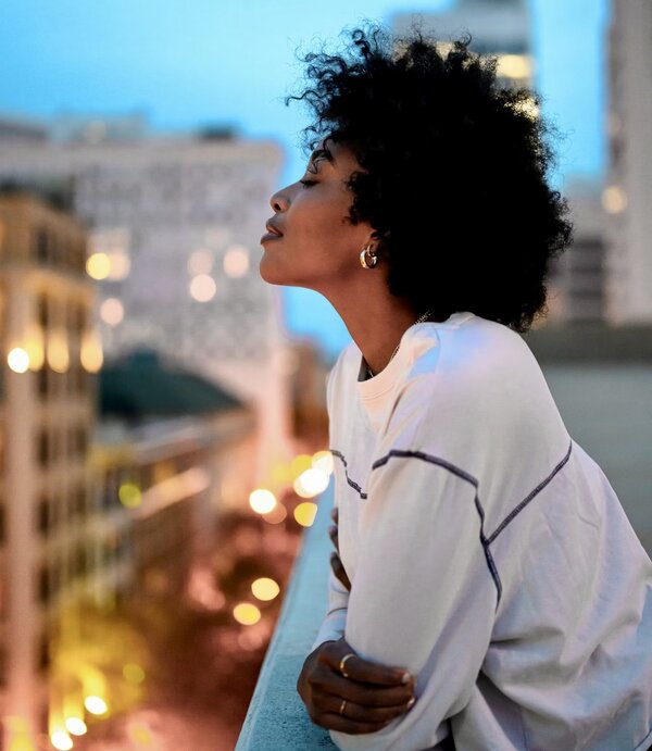 Woman content in city (The Place You Belong Thumbnail)