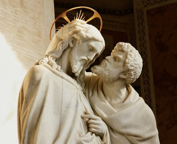 Judas betraying Jesus with a kiss