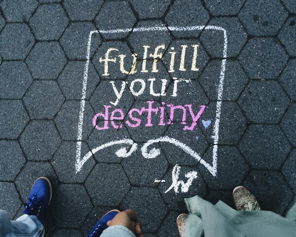 Drawing that says "fulfill your destiny". Gives idea of how evangelism 's role in predestination