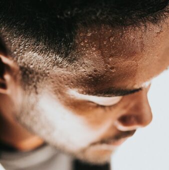 Man sweating after learning how to work hard on the grind