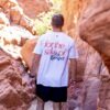 Man wearing "for the sake of the gospel" shirt expressing need for evangelism despite predestination