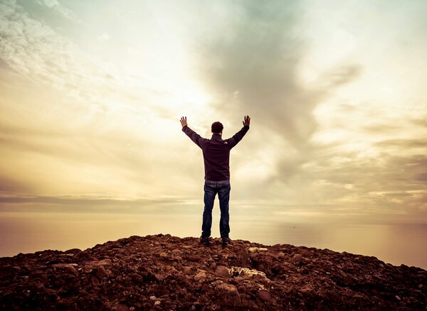 person worshipping God now that his perspective changed and he knows God cares