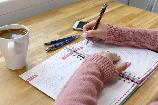 Woman writing down her opportunities to be proactive